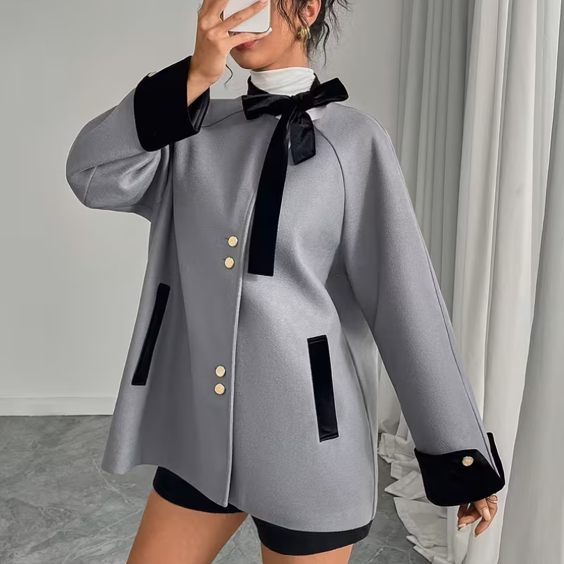 Ladies Gown Featuring a Loose Gray Velvet Collar And Flowing Ribbons